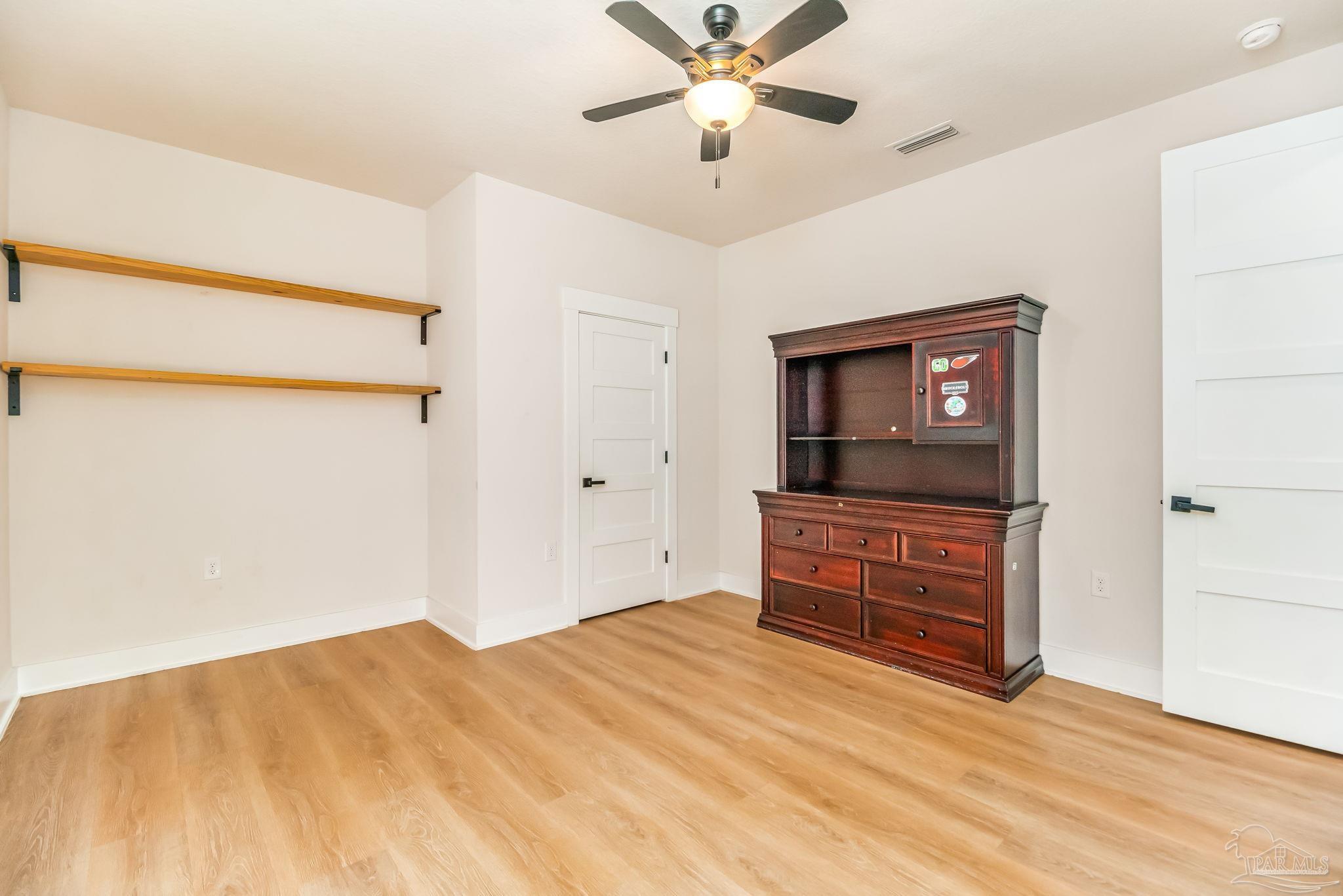 2329 Molino Bridge Road Pace, FL 32571 - Photo 41 of 65 a bedroom with a bed and a dresser