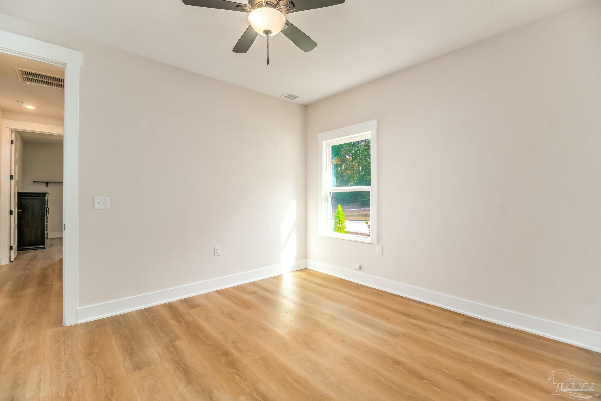 2329 Molino Bridge Road Pace, FL 32571 - Photo 42 of 65 an empty room with a empty space and a window