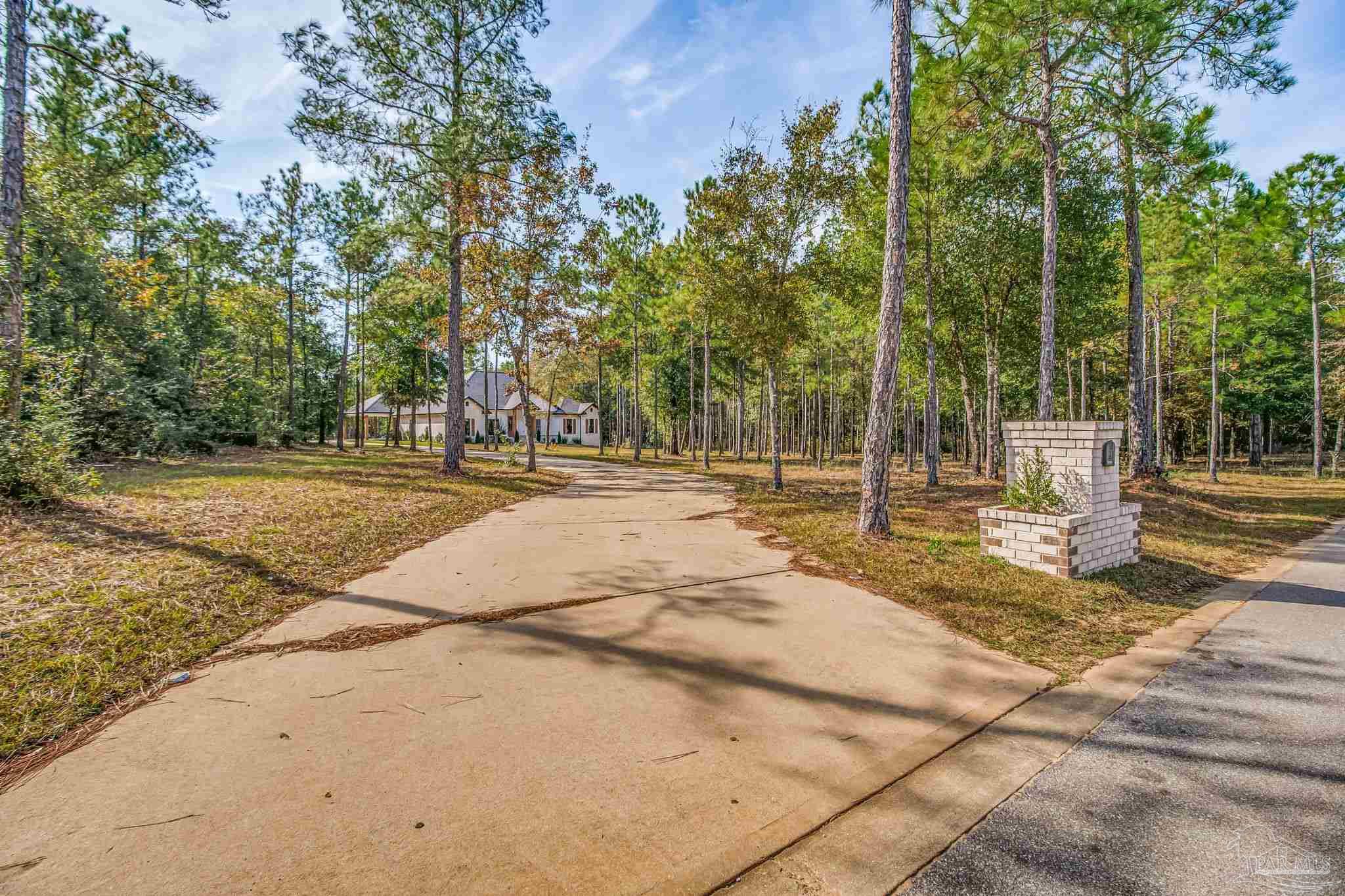 2329 Molino Bridge Road Pace, FL 32571 - Photo 44 of 65 a view of a yard with basketball court