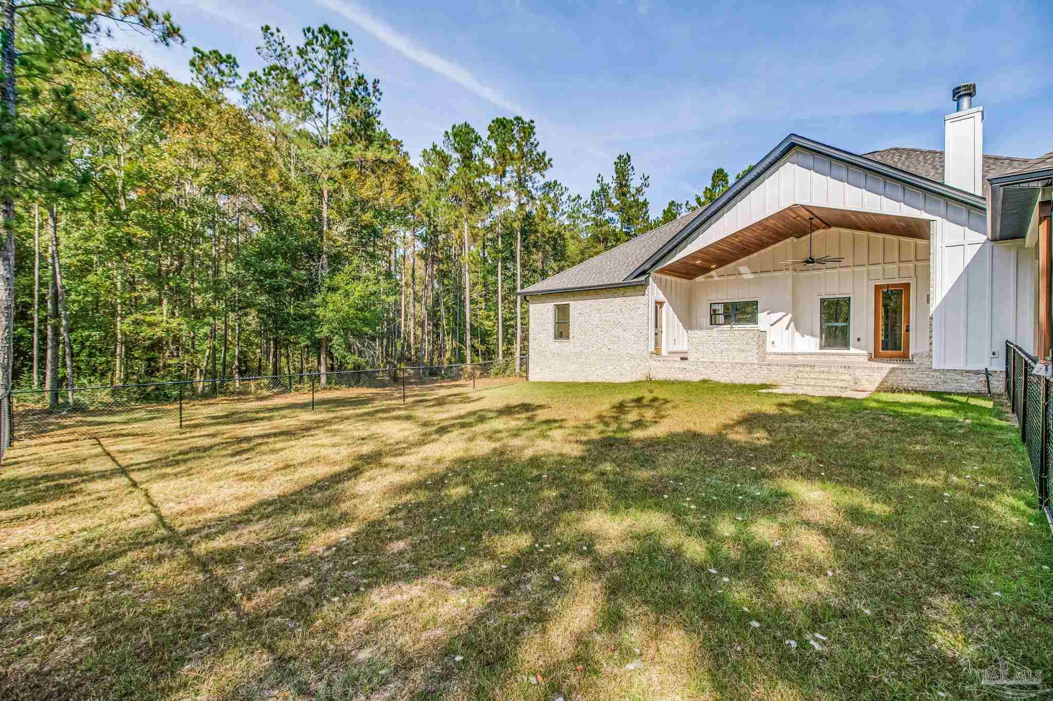 2329 Molino Bridge Road Pace, FL 32571 - Photo 47 of 65 a view of a house with a yard