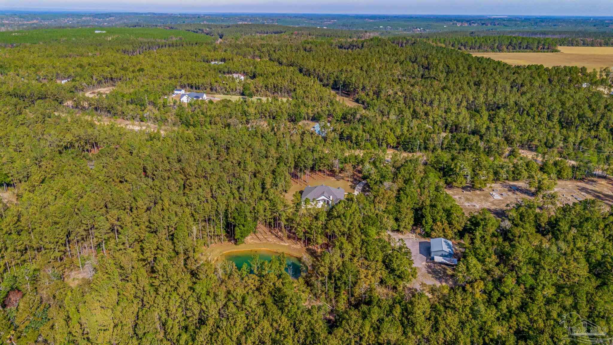 2329 Molino Bridge Road Pace, FL 32571 - Photo 65 of 65 a view of a field with an ocean
