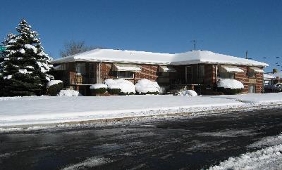 a side view of a house with a yard