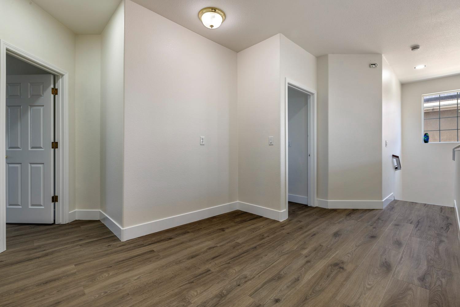 3105 Ripple Court Modesto, CA 95355 - Photo 31 of 46 a view of an empty room with wooden floor