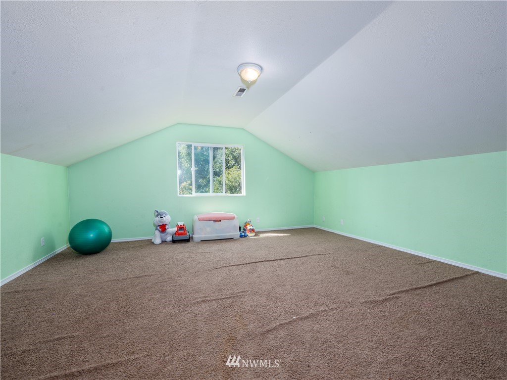 553 River Road Chehalis, WA 98532 - Photo 14 of 22 a view of a room with gym equipment and windows