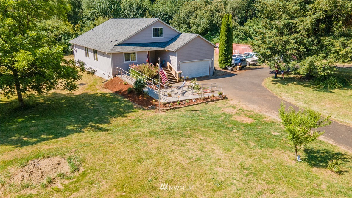 553 River Road Chehalis, WA 98532 - Photo 15 of 22 a view of a house with a yard and sitting area