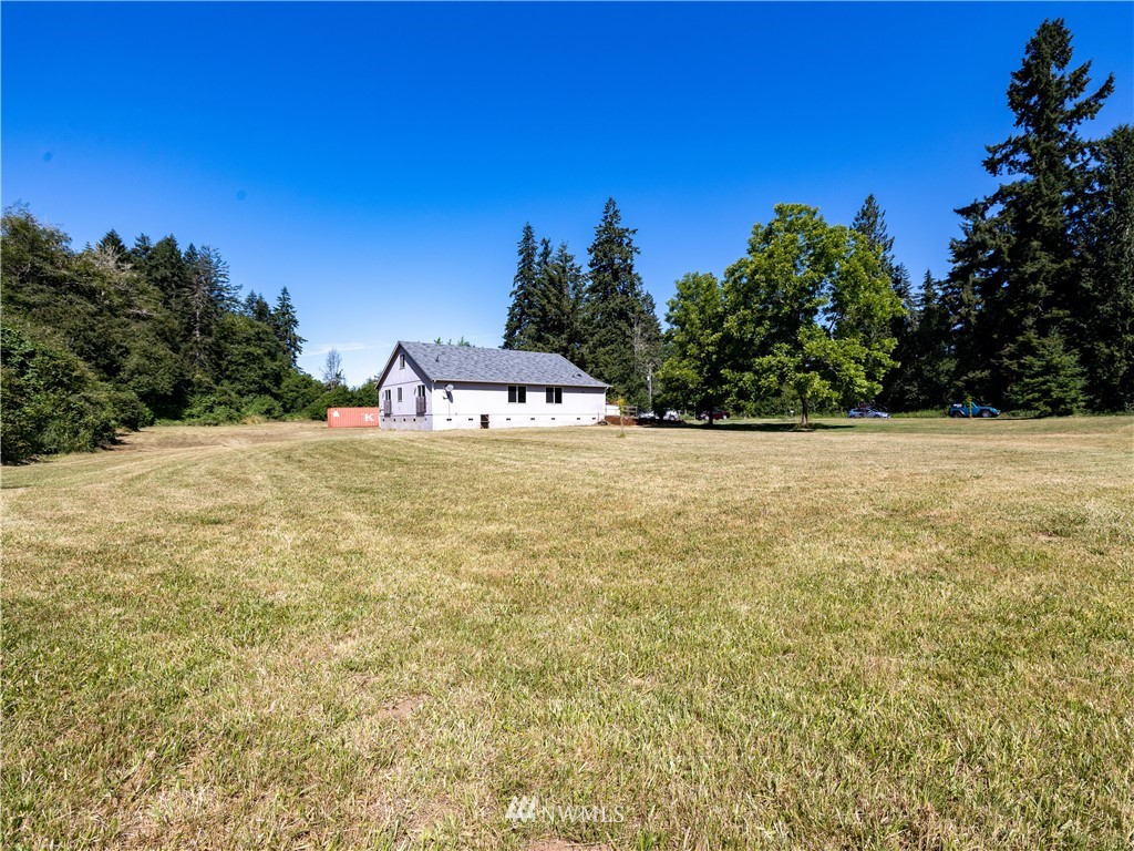 553 River Road Chehalis, WA 98532 - Photo 16 of 22 a view of a swimming pool with an outdoor space and seating area