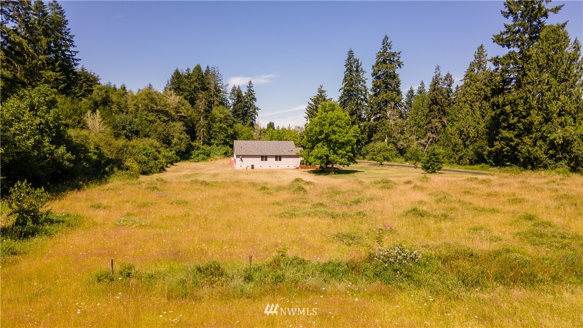 553 River Road Chehalis, WA 98532 - Photo 20 of 22 an aerial view of a house with a yard and lake view