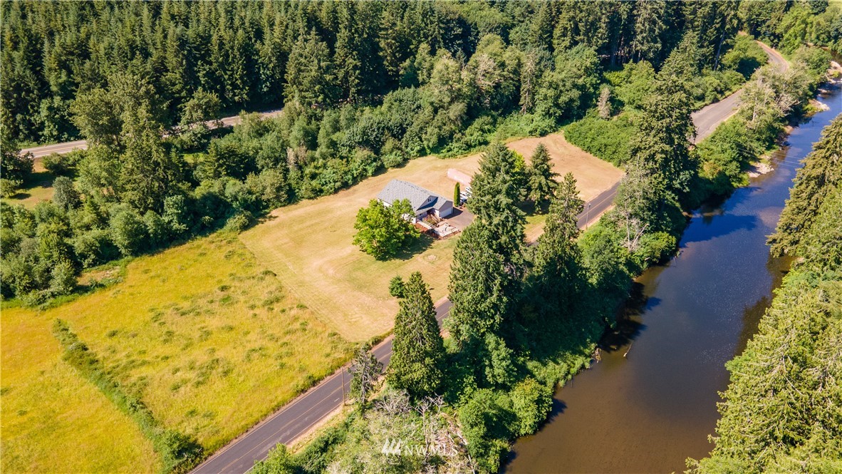 553 River Road Chehalis, WA 98532 - Photo 2 of 22 an aerial view of a house with a yard and lake view