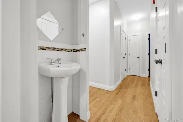 a bathroom with a sink and mirror