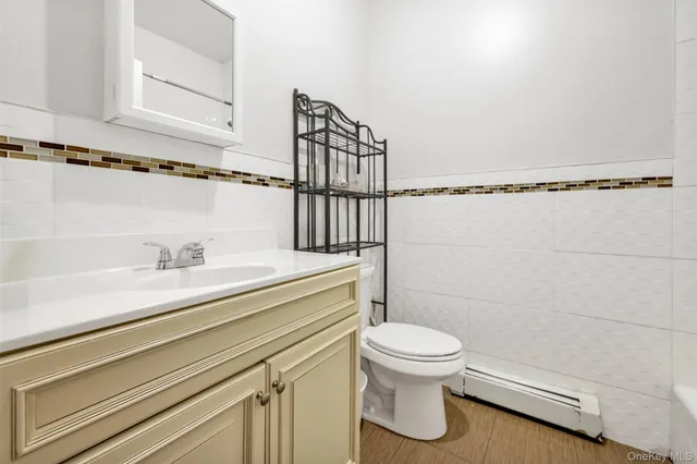 a bathroom with a toilet and a sink