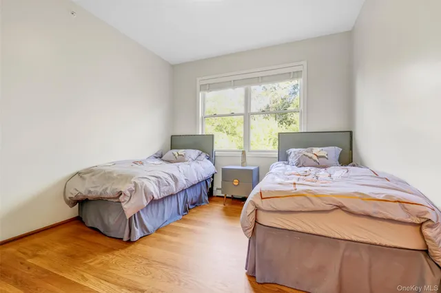 a bedroom with a bed and a table