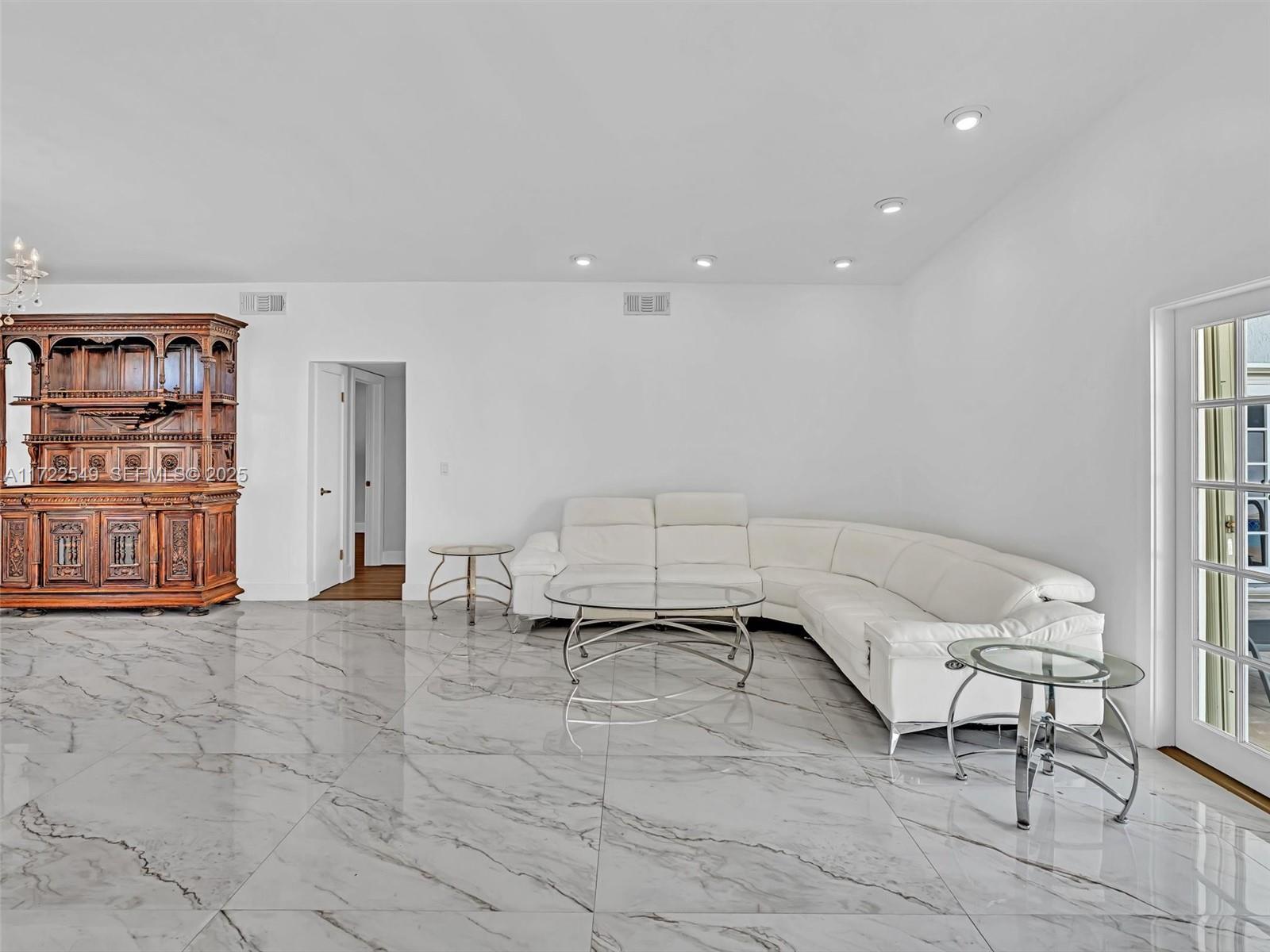 12904 Banyan Road North Miami, FL 33181 - Photo 12 of 87 a living room with furniture cabinets and window