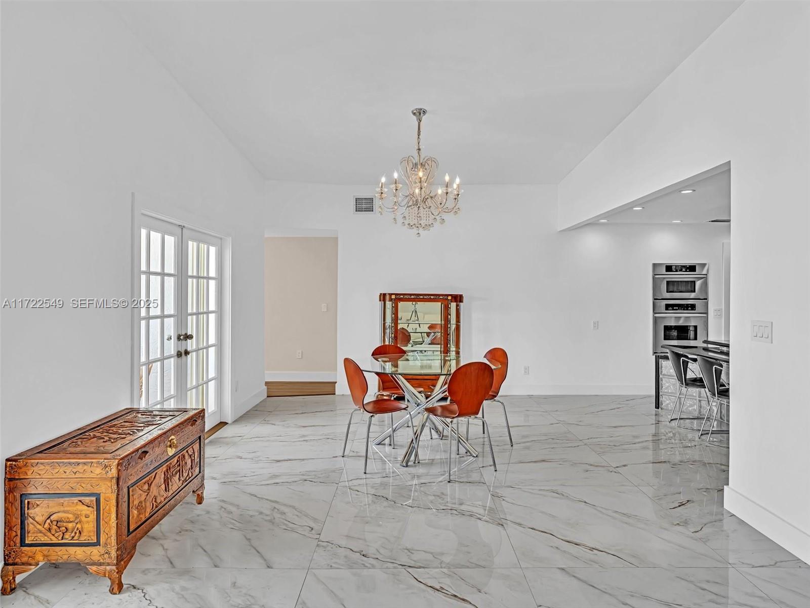 12904 Banyan Road North Miami, FL 33181 - Photo 15 of 87 a dining room with furniture and window