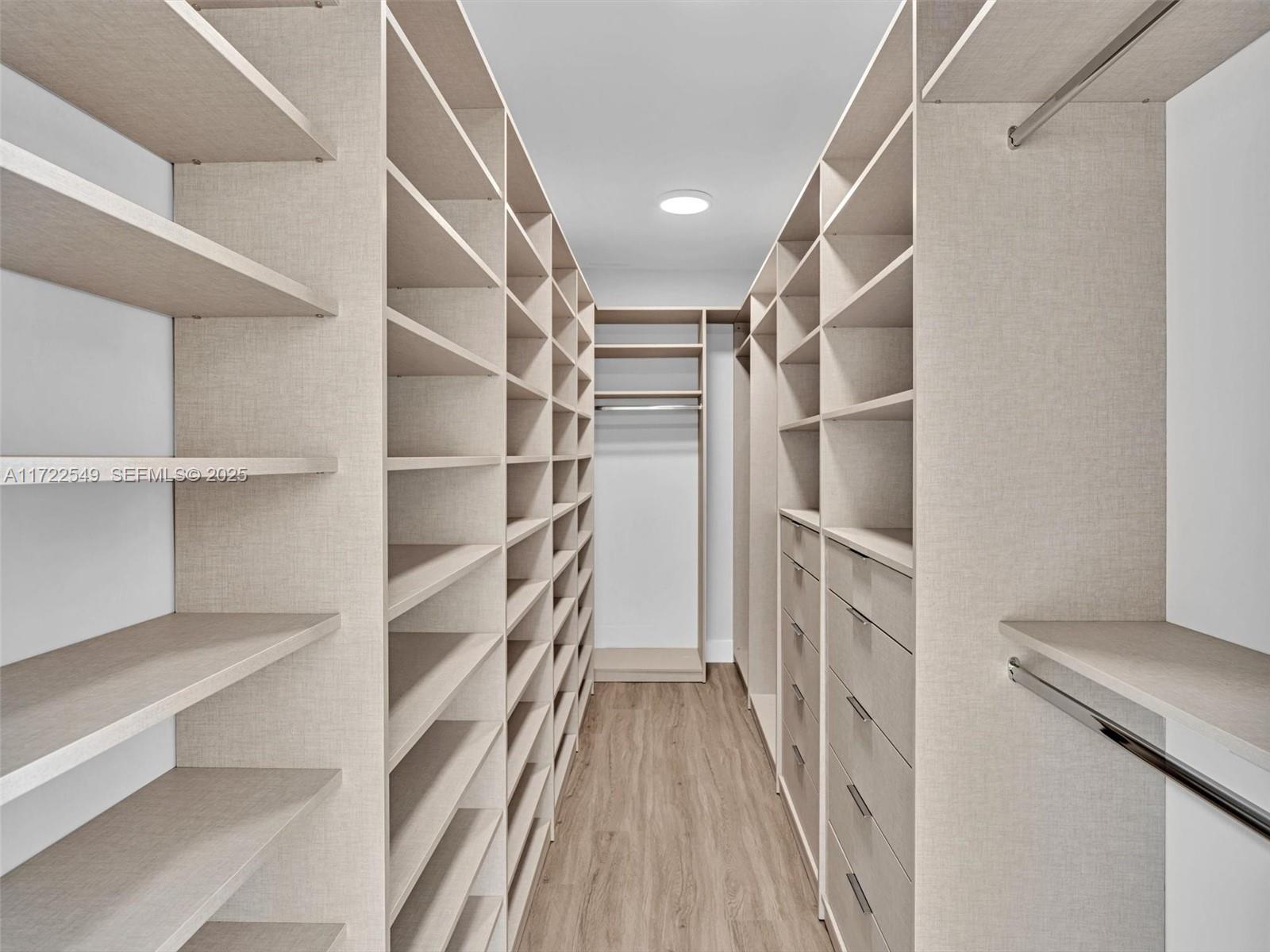 12904 Banyan Road North Miami, FL 33181 - Photo 36 of 87 a view of walk in closet with empty racks