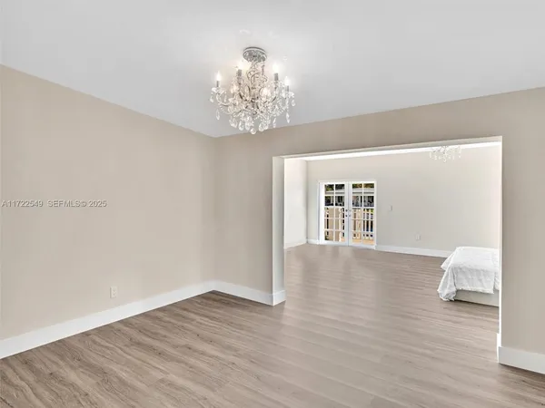 a view of walk in closet with wooden floor