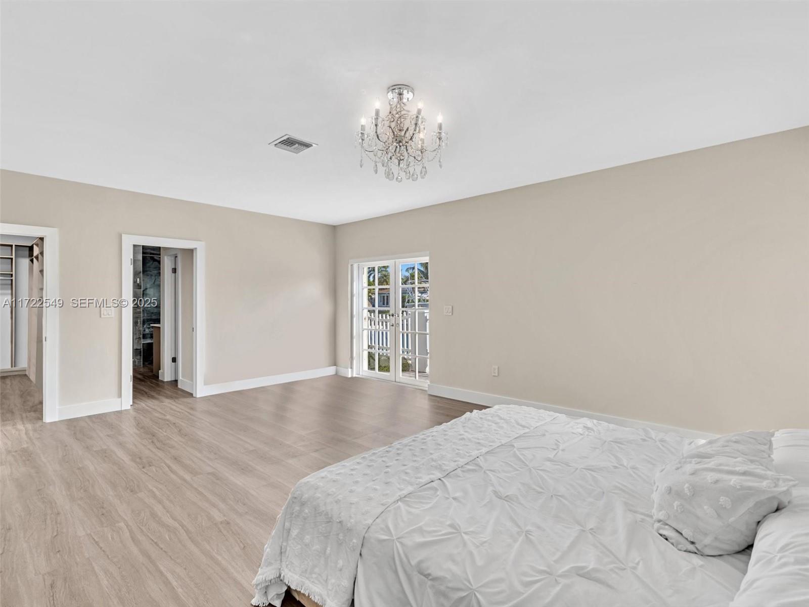 12904 Banyan Road North Miami, FL 33181 - Photo 40 of 87 a view of empty room with wooden floor