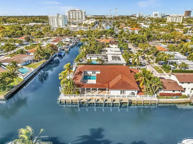 a kitchen with refrigerator and window