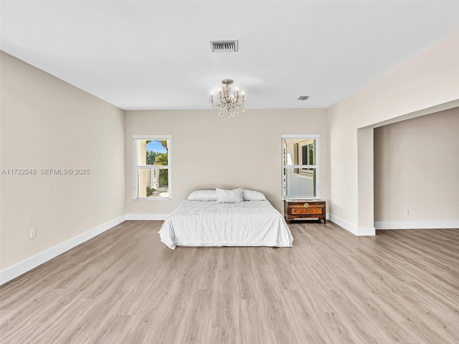 12904 Banyan Road North Miami, FL 33181 - Photo 43 of 87 a bedroom with wooden floor and window