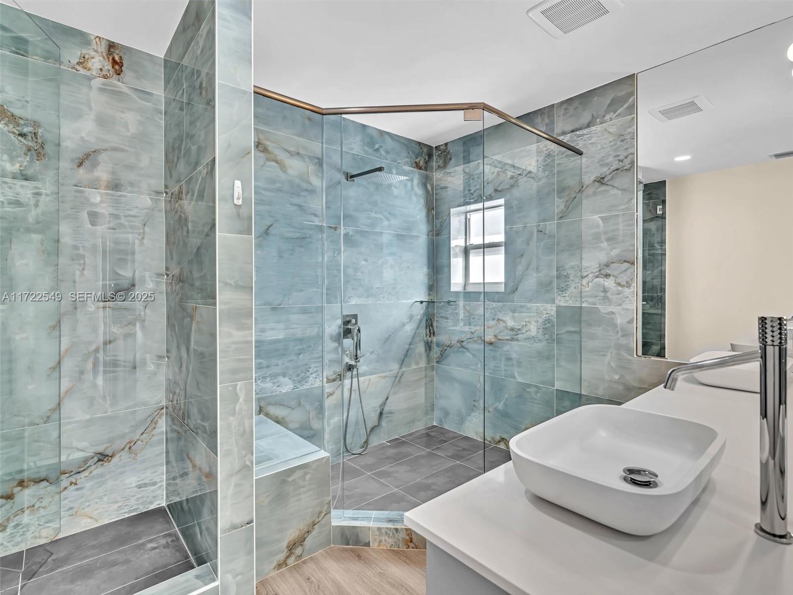 12904 Banyan Road North Miami, FL 33181 - Photo 46 of 87 a bathroom with a sink a toilet and shower