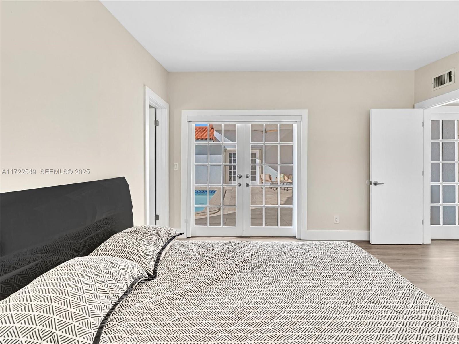12904 Banyan Road North Miami, FL 33181 - Photo 56 of 87 a bedroom with a bed and a window