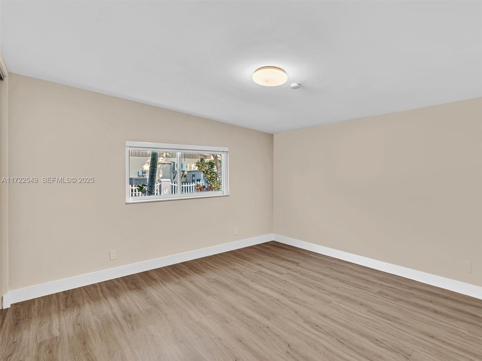 12904 Banyan Road North Miami, FL 33181 - Photo 61 of 87 a view of a room with wooden floor and window