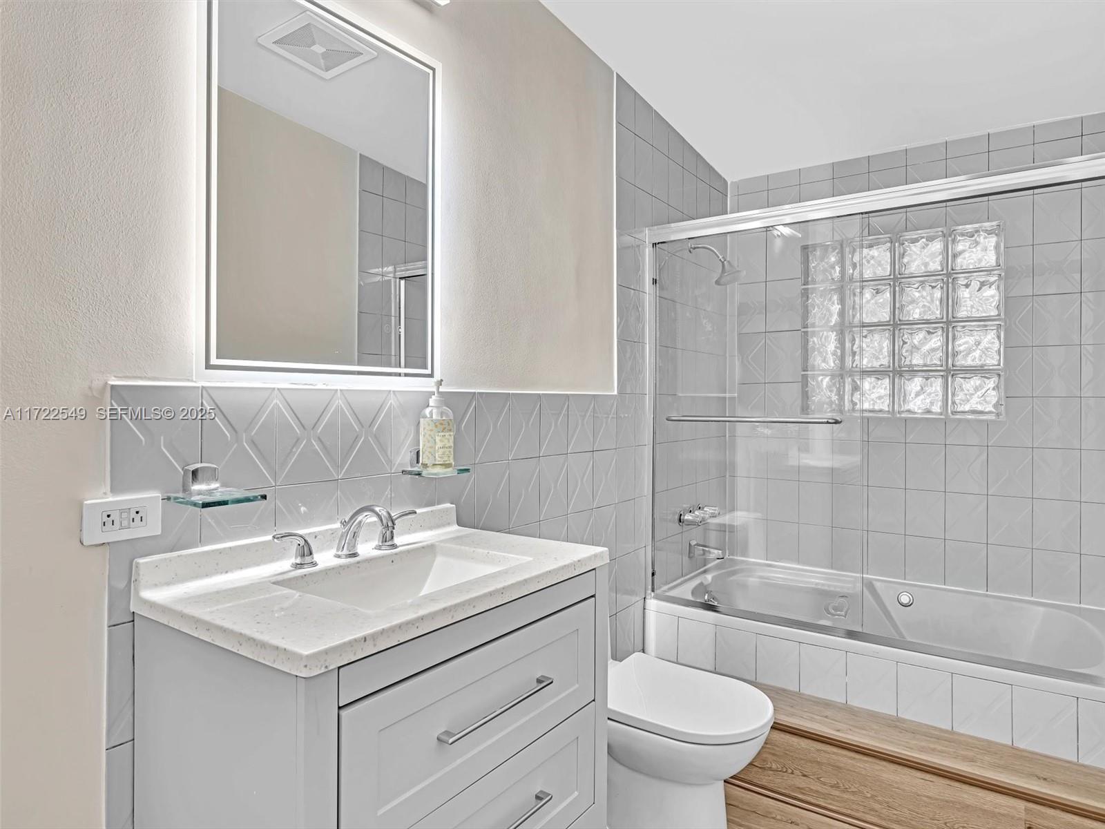 12904 Banyan Road North Miami, FL 33181 - Photo 66 of 87 a bathroom with a sink a toilet and shower