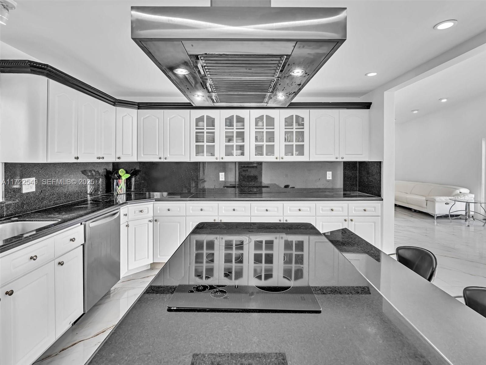 12904 Banyan Road North Miami, FL 33181 - Photo 7 of 87 a kitchen with stainless steel appliances kitchen island granite countertop a sink and cabinets