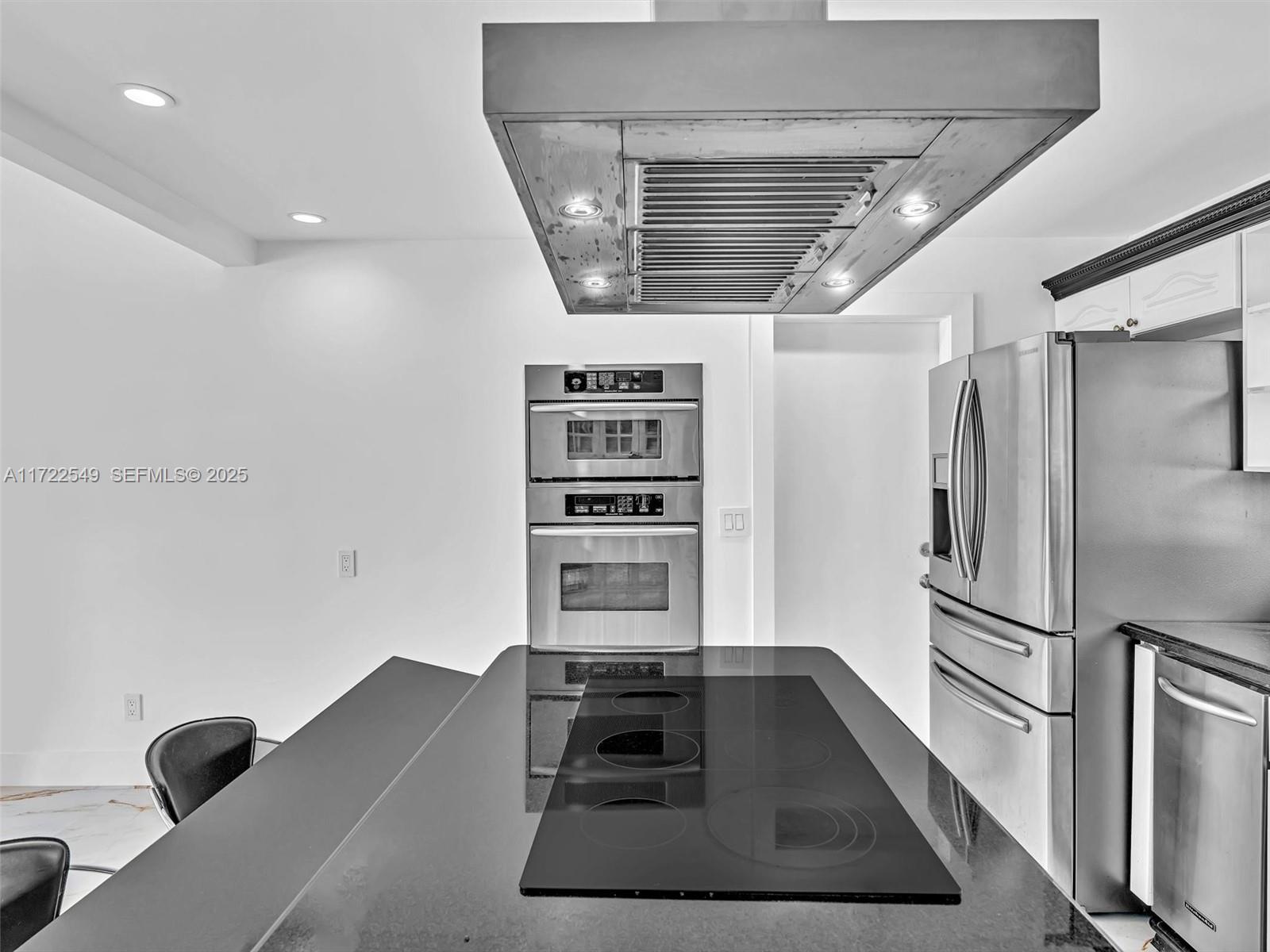 12904 Banyan Road North Miami, FL 33181 - Photo 9 of 87 a kitchen with refrigerator and window
