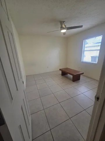 a view of an empty room and a window