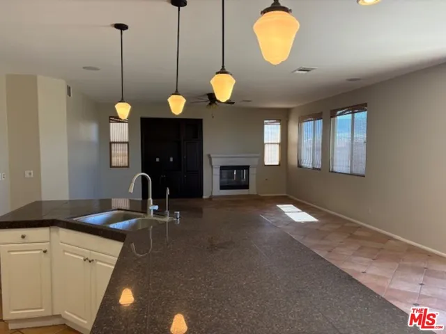 a kitchen with a sink cabinets and window