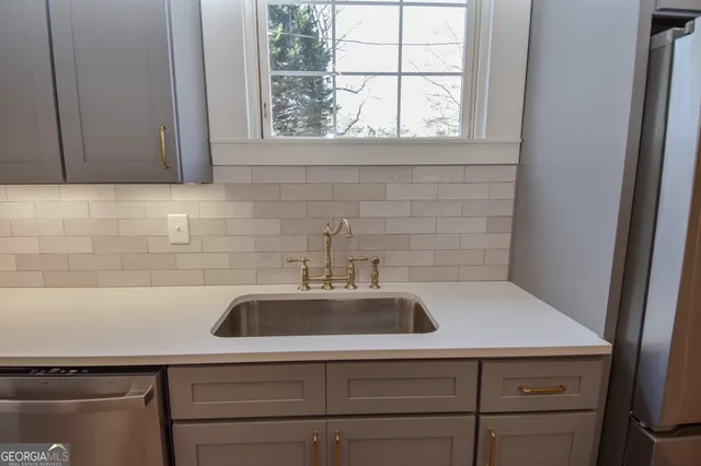 a view of a room with wooden floor and staircase