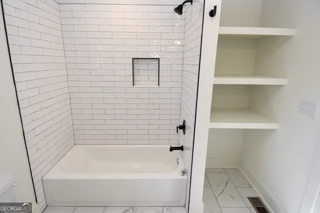 a bathroom with a sink and toilet