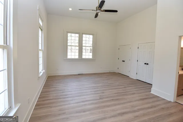 a view of a yard with flower plants