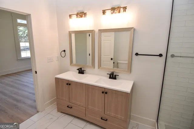 a view of a house with a yard covered in snow