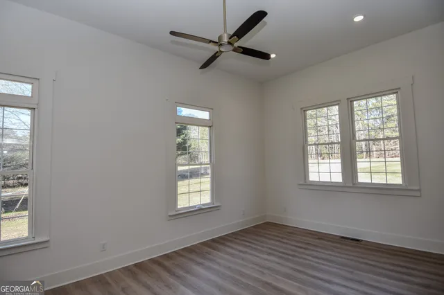 a view of a swimming pool with a house in the background
