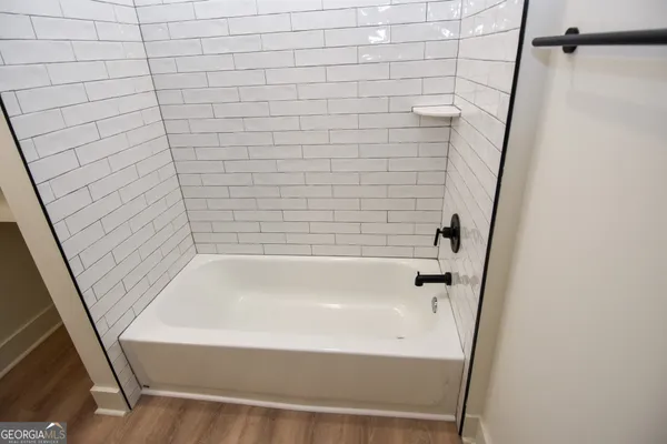 a front view of house with yard and entertaining space