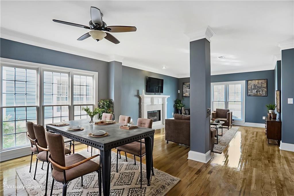 484 Martin Street Southeast Atlanta, GA 30312 - Photo 3 of 19 a view of a dining room with furniture window and wooden floor