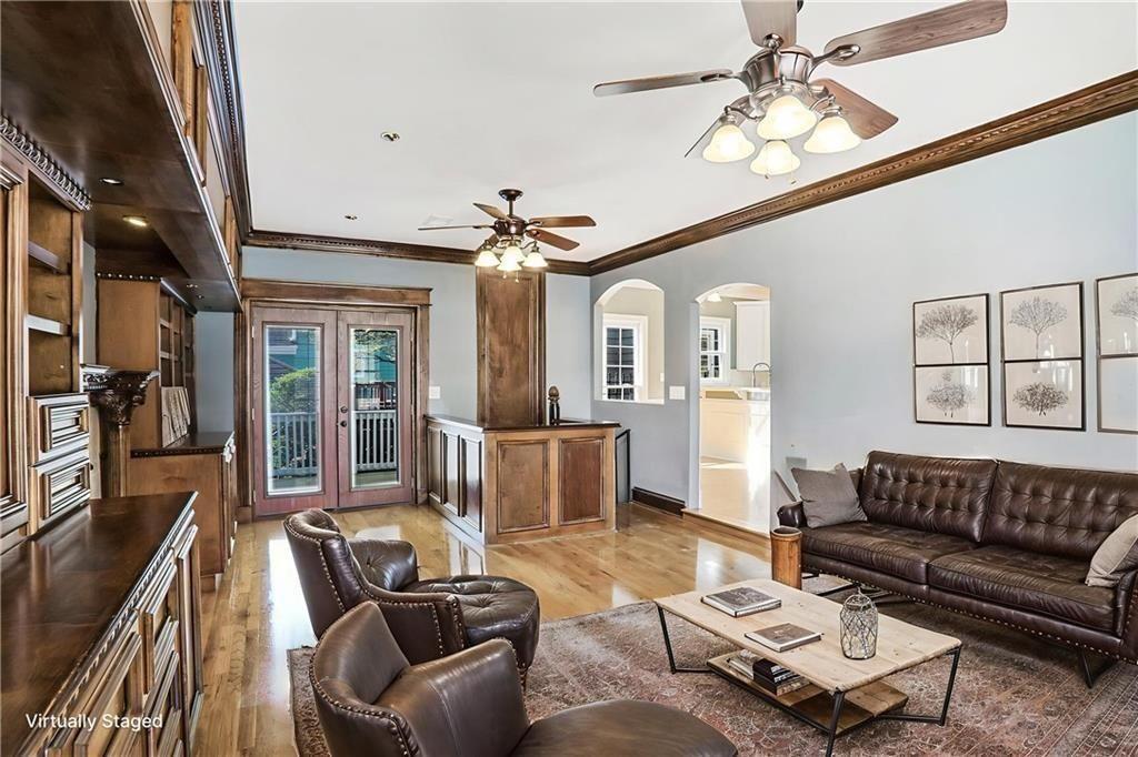 484 Martin Street Southeast Atlanta, GA 30312 - Photo 7 of 19 a living room with furniture and a chandelier