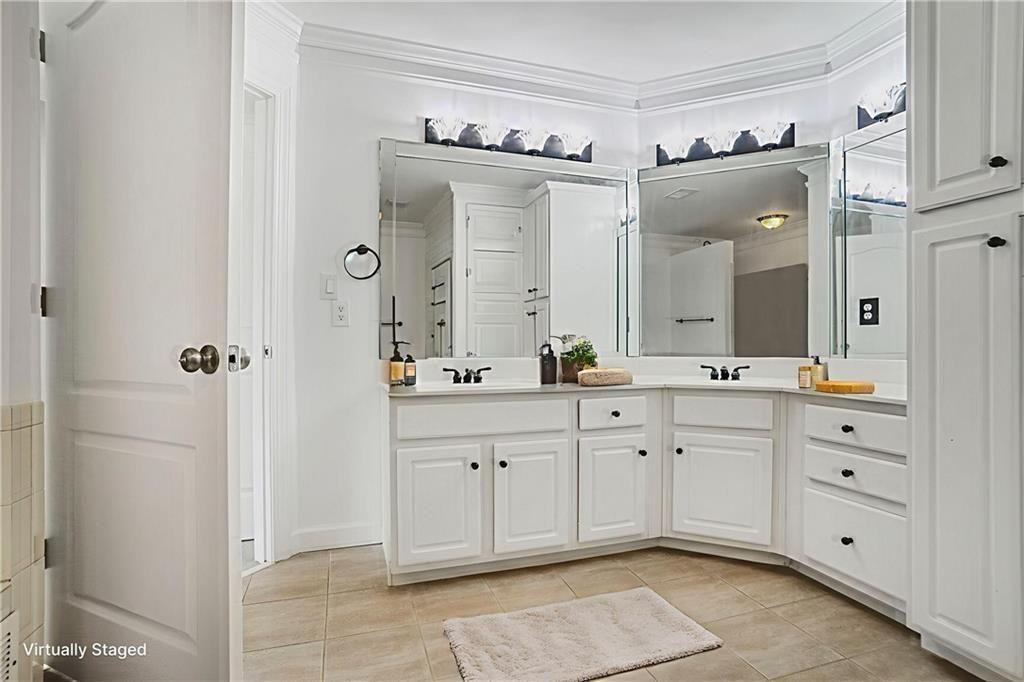 484 Martin Street Southeast Atlanta, GA 30312 - Photo 9 of 19 a spacious bathroom with a double vanity sink mirror and shower