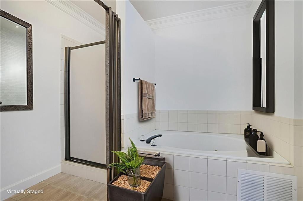 484 Martin Street Southeast Atlanta, GA 30312 - Photo 10 of 19 a bathroom with a bathtub and a sink
