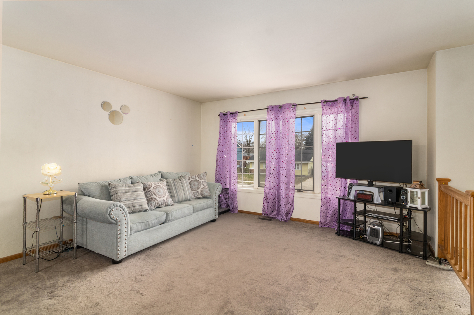 620 West Romeo Road Romeoville, IL 60446 - Photo 5 of 16 a living room with furniture and a flat screen tv