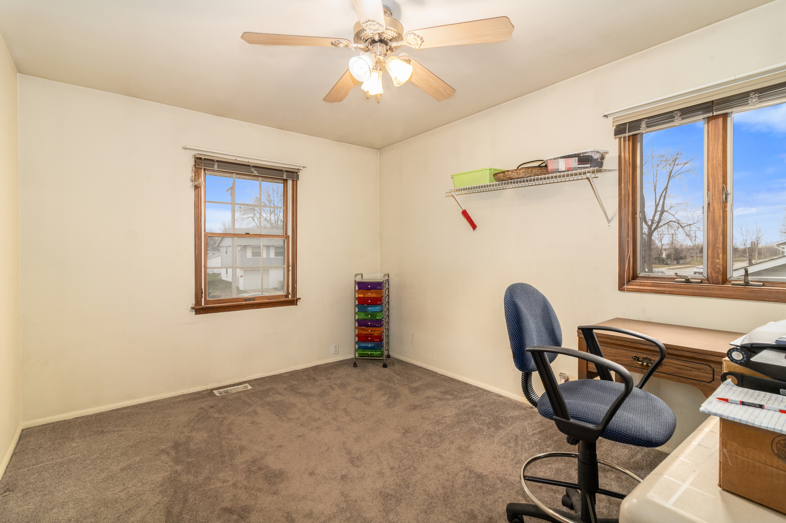 620 West Romeo Road Romeoville, IL 60446 - Photo 9 of 16 a view of a workspace with furniture and a window
