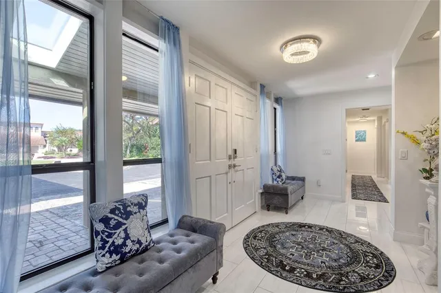 a kitchen with granite countertop a refrigerator stove top oven and sink
