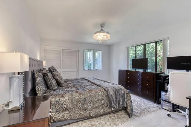 an aerial view of a house with garden space and outdoor seating