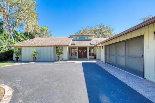 a bedroom with a bed and flat screen tv