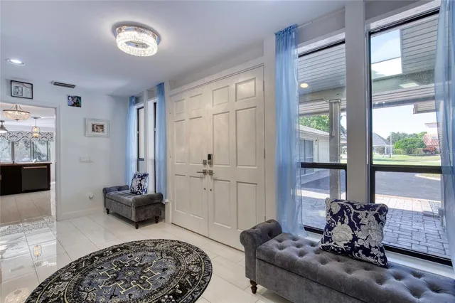 a dining room with furniture a rug and wooden floor
