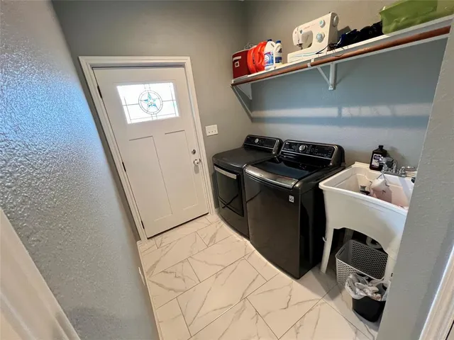 a utility room with dryer and washer