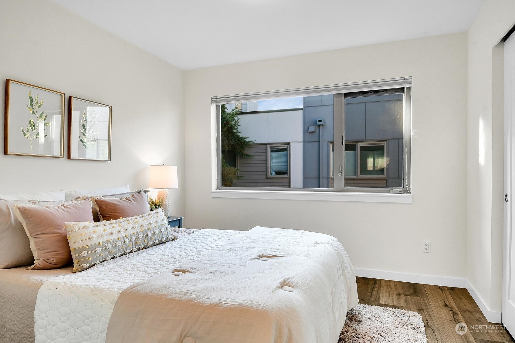 1907 25th Avenue South, Unit A Seattle, WA 98144 - Photo 15 of 23 a bedroom with a bed and a window