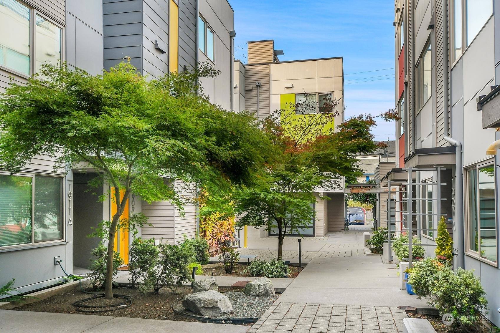 1907 25th Avenue South, Unit A Seattle, WA 98144 - Photo 22 of 23 a view of a building along with street and trees