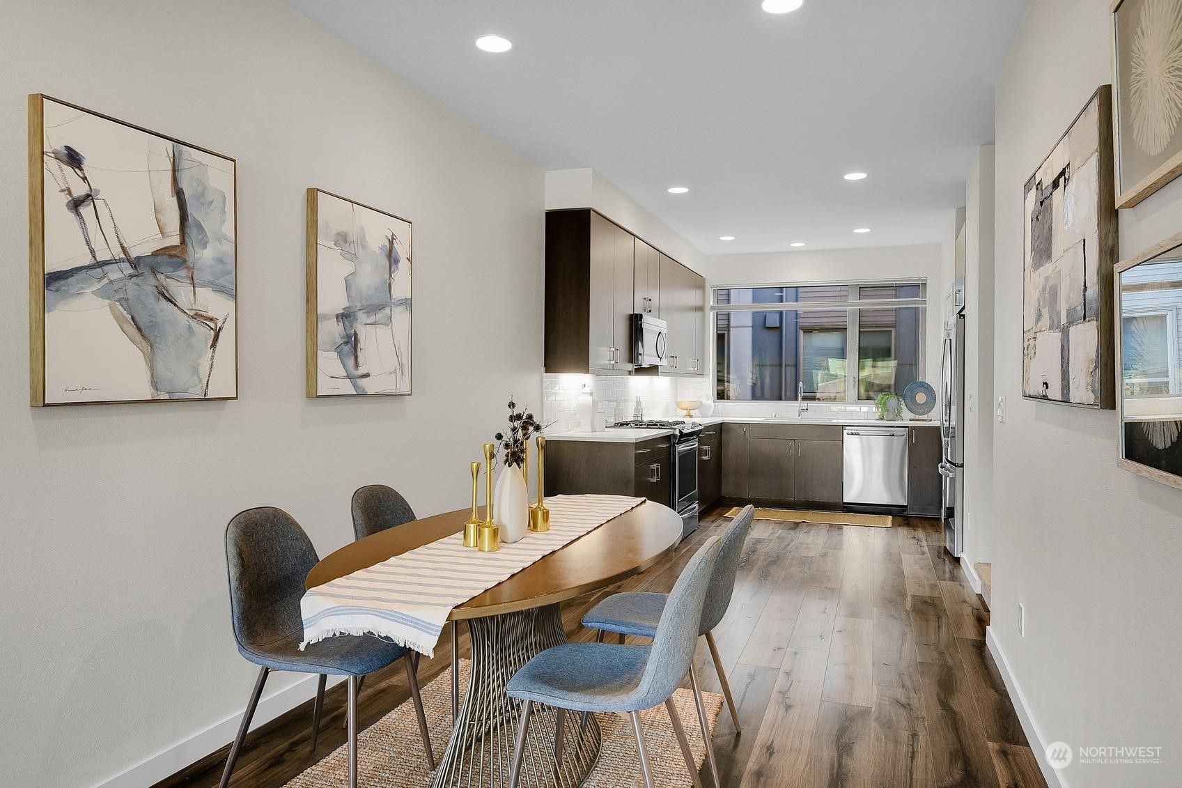 1907 25th Avenue South, Unit A Seattle, WA 98144 - Photo 5 of 23 a living room with furniture a flat screen tv and kitchen view